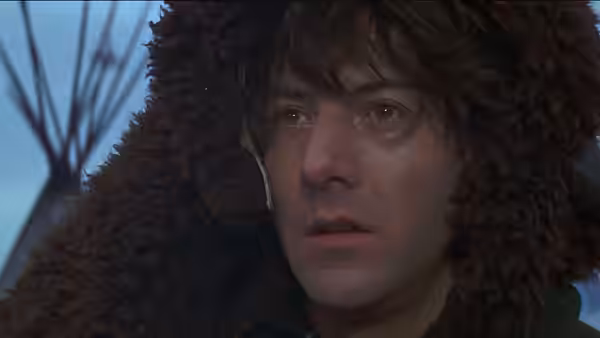 Jack Crabb (Dustin Hoffman) wears a fur hood and looks ahead