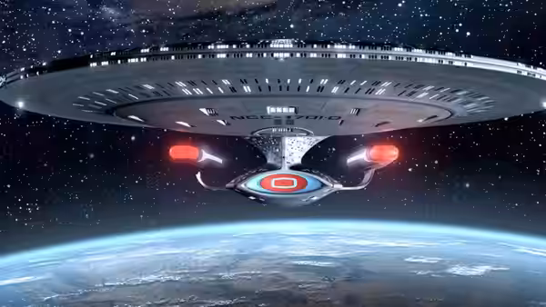 USS Enterprise-D viewed from below above the planet Earth