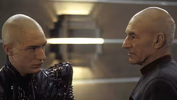 Shinzon (Tom Hardy) and Picard (Patrick Stewart) face each other in a corridor