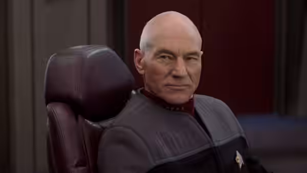 Picard (Patrick Stewart) sits in the captain's chair on the bridge