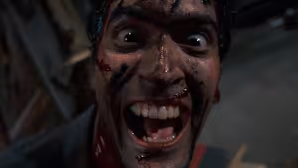Man with bloodied face stares with wide eyes and open mouth