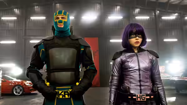 Colonel Stars and Stripes (Jim Carrey) and Hit Girl (Chloë Grace Moretz) in a hangar