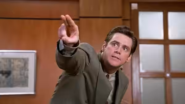 Fletcher Reede (Jim Carrey) reaching forward with an outstretched arm