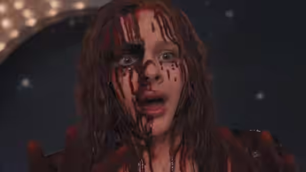 Carrie White (Chloë Grace Moretz) reaches out with blood on her face