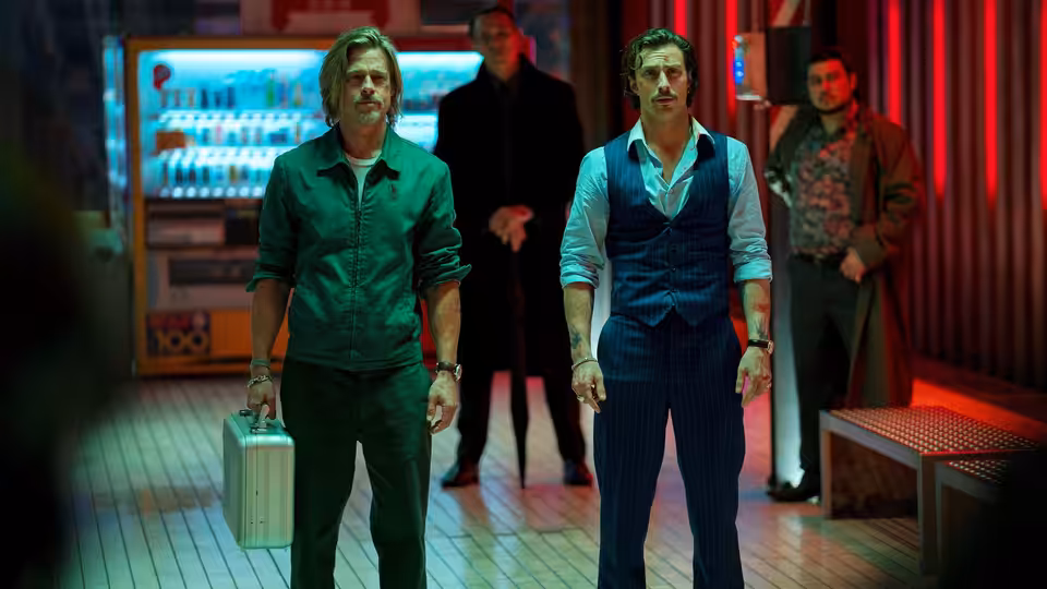 Ladybug (Brad Pitt) and Tangerine (Aaron Taylor-Johnson) standing in a station lounge