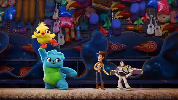 Ducky held up by Bunny as Woody and Buzz Lightyear watch in a toy store