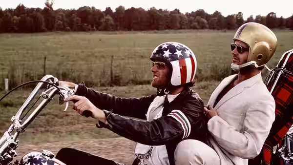 Billy (Dennis Hopper) steers his motorcycle as Wyatt (Peter Fonda) rides behind him