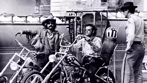 Billy (Dennis Hopper) and Wyatt (Peter Fonda) talk with a man beside their motorcycles