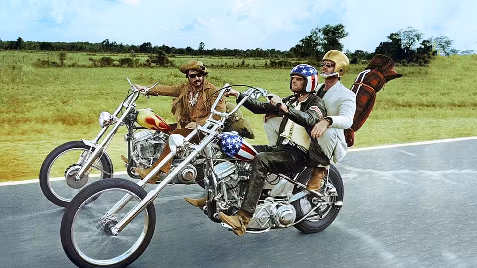 Billy (Dennis Hopper) and Wyatt (Peter Fonda) ride their motorcycles along a country road
