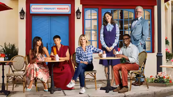 Eleanor Shellstrop (Kristen Bell) and friends sit outside a yogurt shop with Michael (Ted Danson) and Tahani Al-Jamil (Jameela Jamil) standing