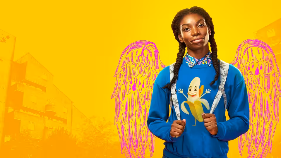 Tracey Gordon (Michaela Coel) with large pink wings holding her backpack straps