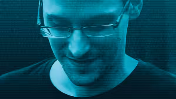 Edward Snowden smiling with green binary code over his face