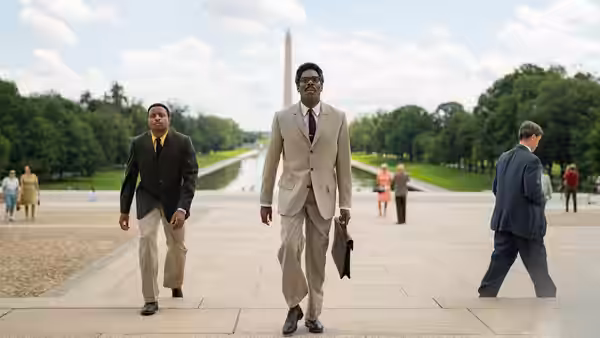 Bayard Rustin (Colman Domingo) walks toward the Lincoln Memorial with a colleague