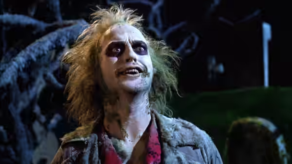 Betelgeuse (Michael Keaton) looking upwards with mouth open in darkness