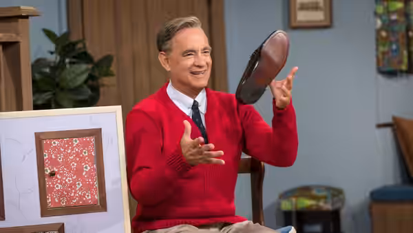 Fred Rogers (Tom Hanks) tosses a shoe in his office