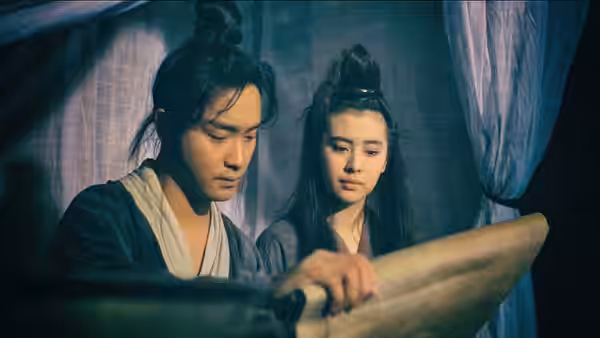 Ling Choi-san (Leslie Cheung) and Lip Siu Sin (Joey Wong) read a scroll together