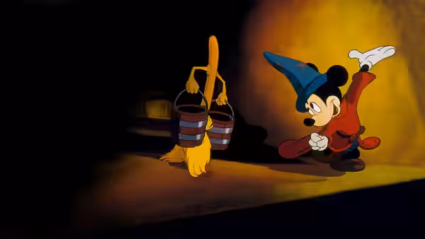 Mickey Mouse (Walt Disney) stands beside brooms carrying water buckets indoors