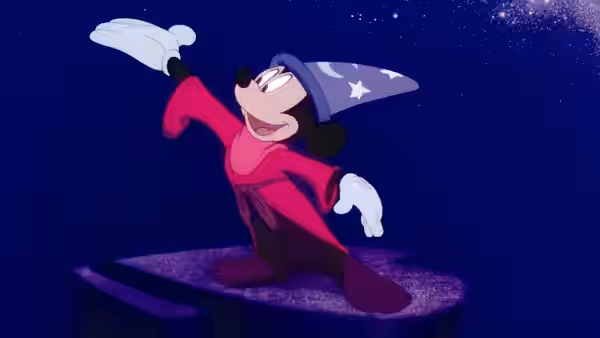 Mickey Mouse (Walt Disney) stands on a pedestal under a starry sky