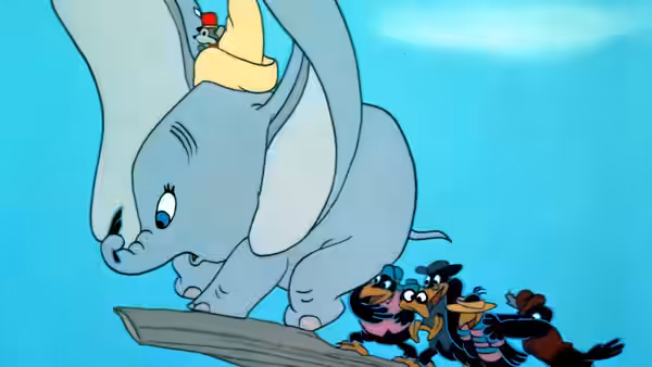 Dumbo peering down at five crows standing on a plank