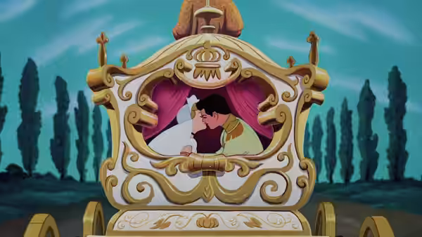 Prince looking out window of ornate golden carriage at dusk