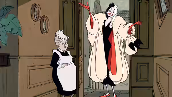 Cruella De Vil gestures in the doorway while Nanny watches nearby