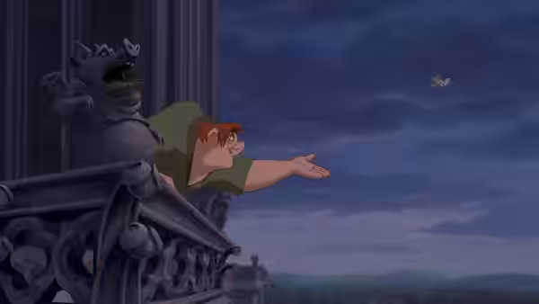 Quasimodo leans from a balcony reaching toward a bird beside a stone gargoyle
