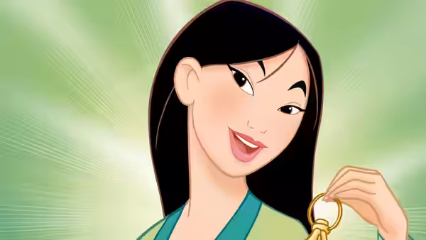 Mulan (Ming-Na Wen) smiling while holding a golden ring