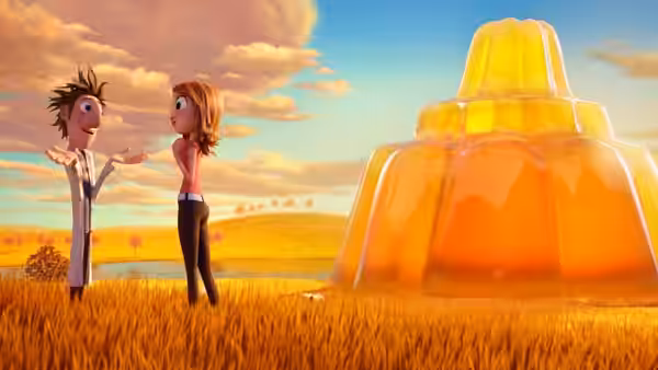 Flint Lockwood and Sam Sparks face each other beside a giant orange gelatin dessert in a field