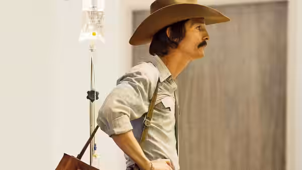 Ron Woodroof (Matthew McConaughey) stands near IV drip in medical hallway