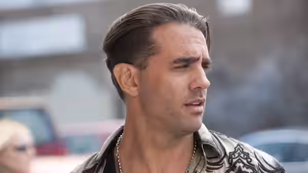 Chili (Bobby Cannavale) looking to the side outdoors