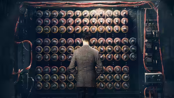 Alan Turing (Benedict Cumberbatch) facing a vast array of code wheels