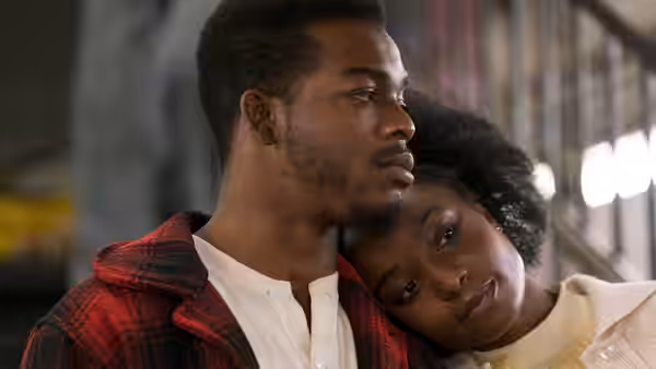 Fonny (Stephan James) stands with Tish (KiKi Layne) resting her head on his shoulder