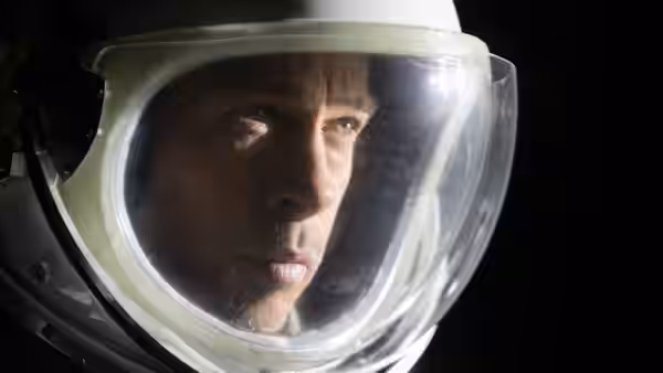 Roy McBride (Brad Pitt) stares ahead through a clear spacesuit visor