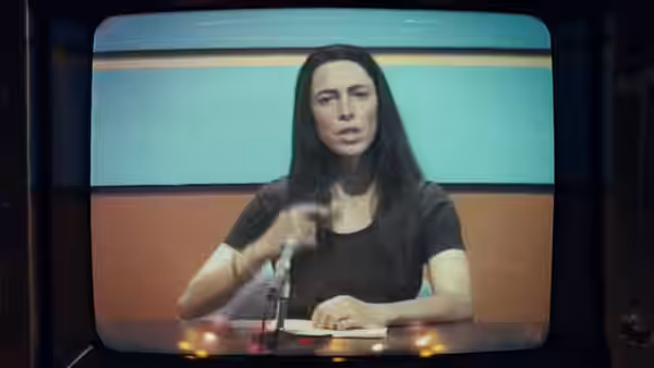 Christine Chubbuck (Rebecca Hall) on a television screen gesturing