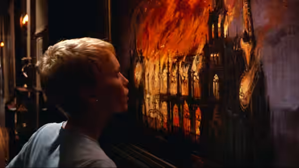 Rosemary Woodhouse (Mia Farrow) watches a building burn through a window