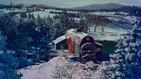 A snow-covered house and outbuildings sit among trees in a winter landscape