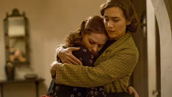 Mildred Pierce (Kate Winslet) embracing Veda Pierce (Evan Rachel Wood)