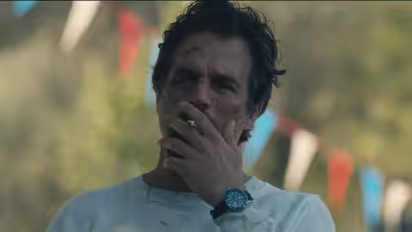 Mark Ruffalo with facial injuries holding hand to his mouth