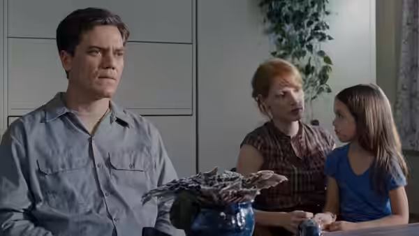 Curtis LaForche (Michael Shannon) sits at the table with his wife Samantha and daughter Hannah
