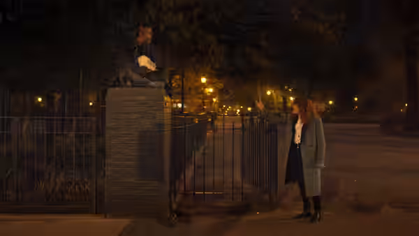 Nadia (Natasha Lyonne) gesturing toward a man perched on a brick pillar at night