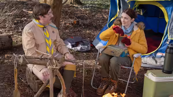 Pat (Jim Howick) and Alison (Charlotte Ritchie) talk while seated at a campsite
