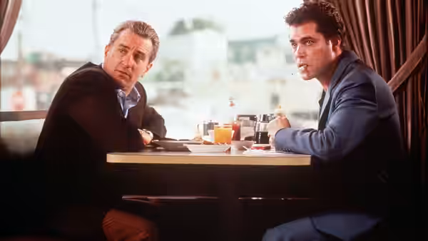 Paul Cicero (Paul Sorvino) and Henry Hill (Ray Liotta) seated at a diner table
