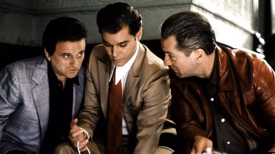 Henry Hill (Ray Liotta), Tommy DeVito (Joe Pesci) and James Conway (Robert De Niro) examining an object