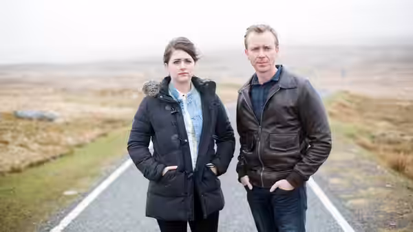 Alison McIntosh (Alison O'Donnell) and Jimmy Perez (Douglas Henshall) standing on a misty road