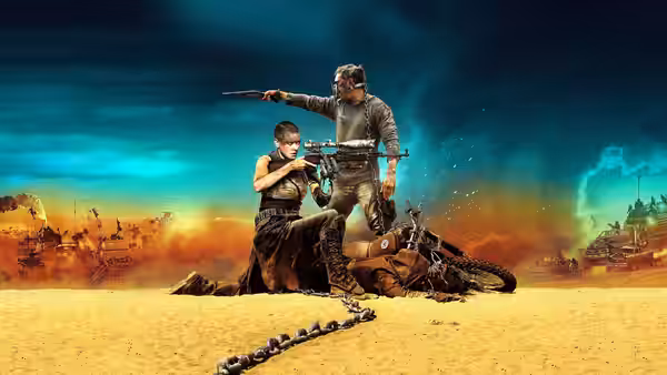 A woman and man aim guns over a crashed vehicle in the desert