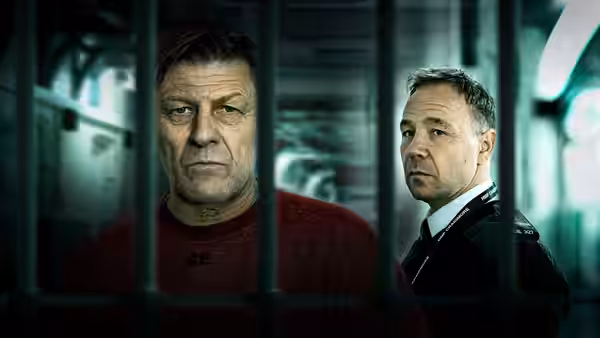 Sean Bean as Mark Cobden and Stephen Graham as Eric McNally behind prison bars