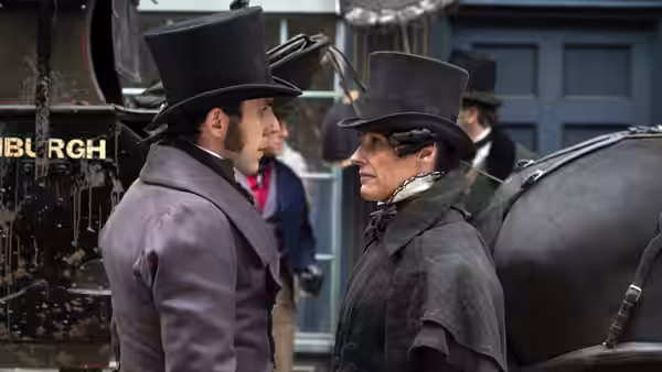 Two men in top hats facing each other beside a carriage outdoors