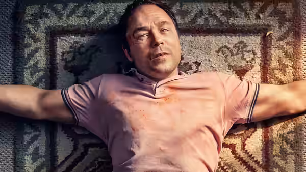 Joseph (Stephen Graham) lying on his back on a patterned rug