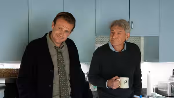 Jimmy (Jason Segel) and Dr. Paul Rhodes (Harrison Ford) standing in a kitchen