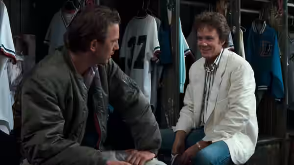 Crash Davis (Kevin Costner) talking with a man in the dugout